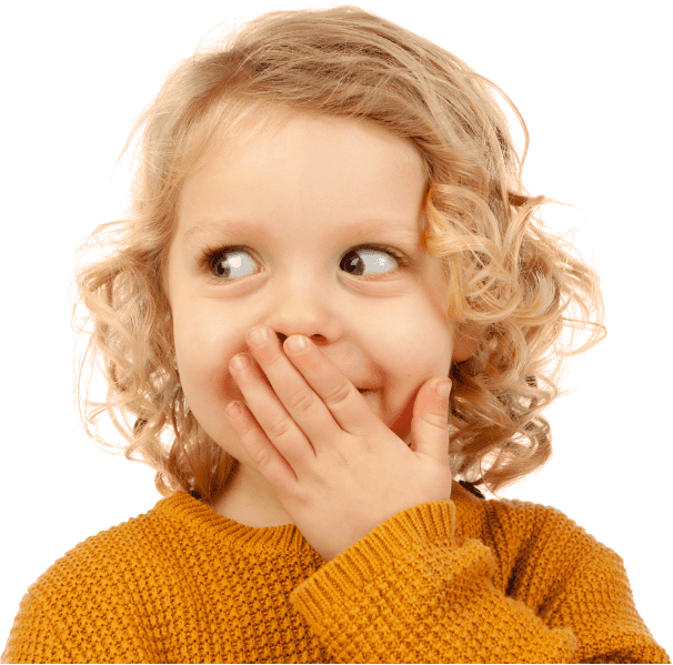 Analyze humorous child covering mouth with hand, expressing surprise or amusement.